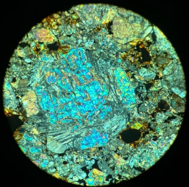 large bright blue grain with some gray lined inclusions