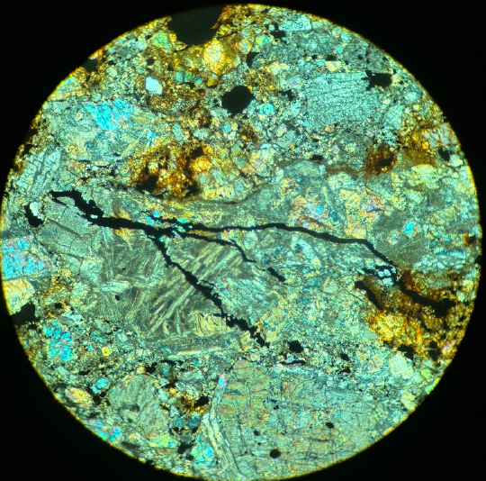 black irregular cracks across chondrules